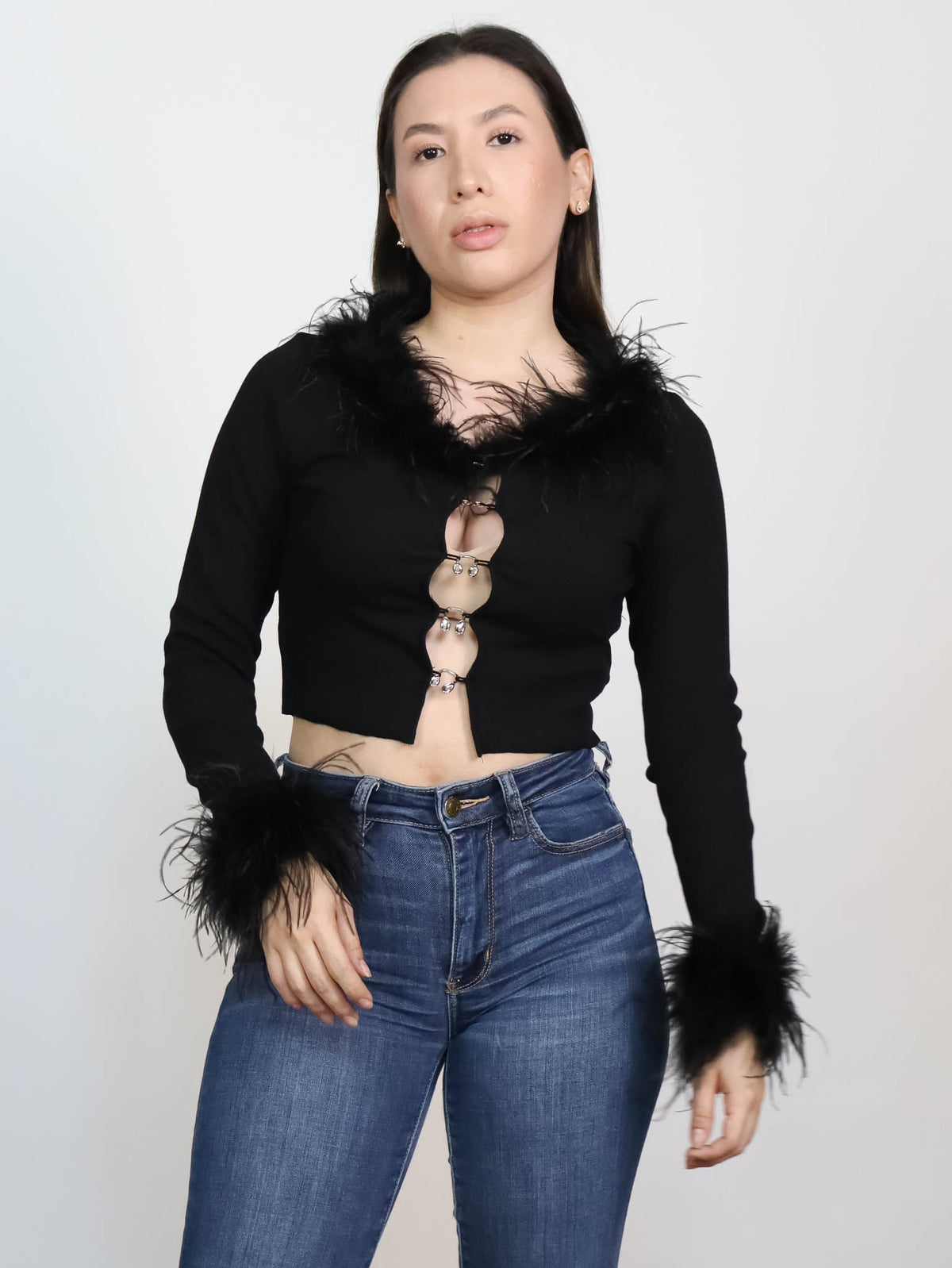 Blusa manga larga con plumas
